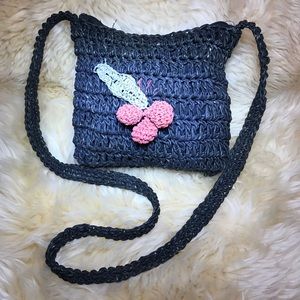 Charming straw with Cherry’s black shoulder bag